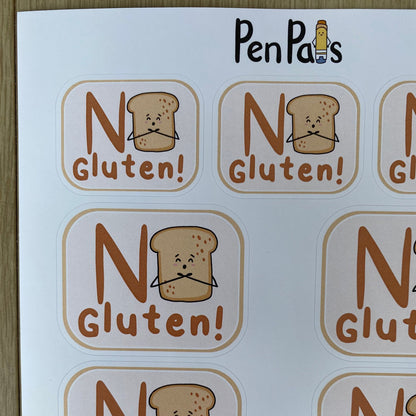 A sheet of round stickers printed with the words 'No Gluten!' and a small cartoon slice of bread with a sad face. The brand name 'PenPals' appears at the top of the sheet.
